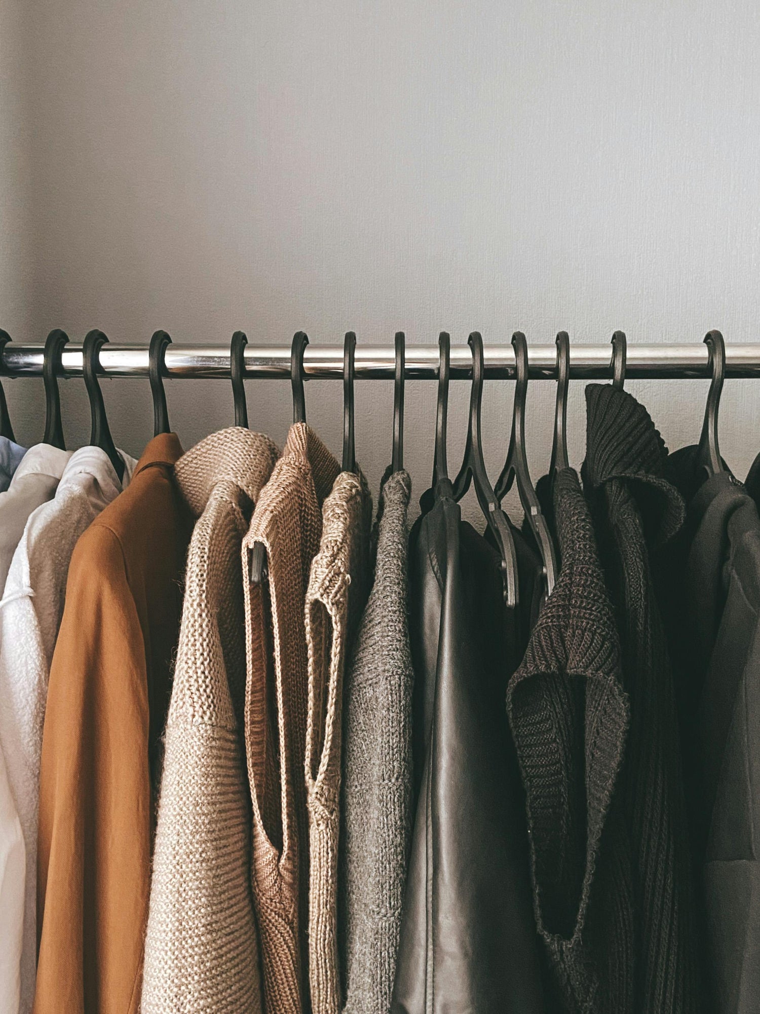 Curated wardrobe styled with neutral, cohesive pieces for effortless daily dressing.