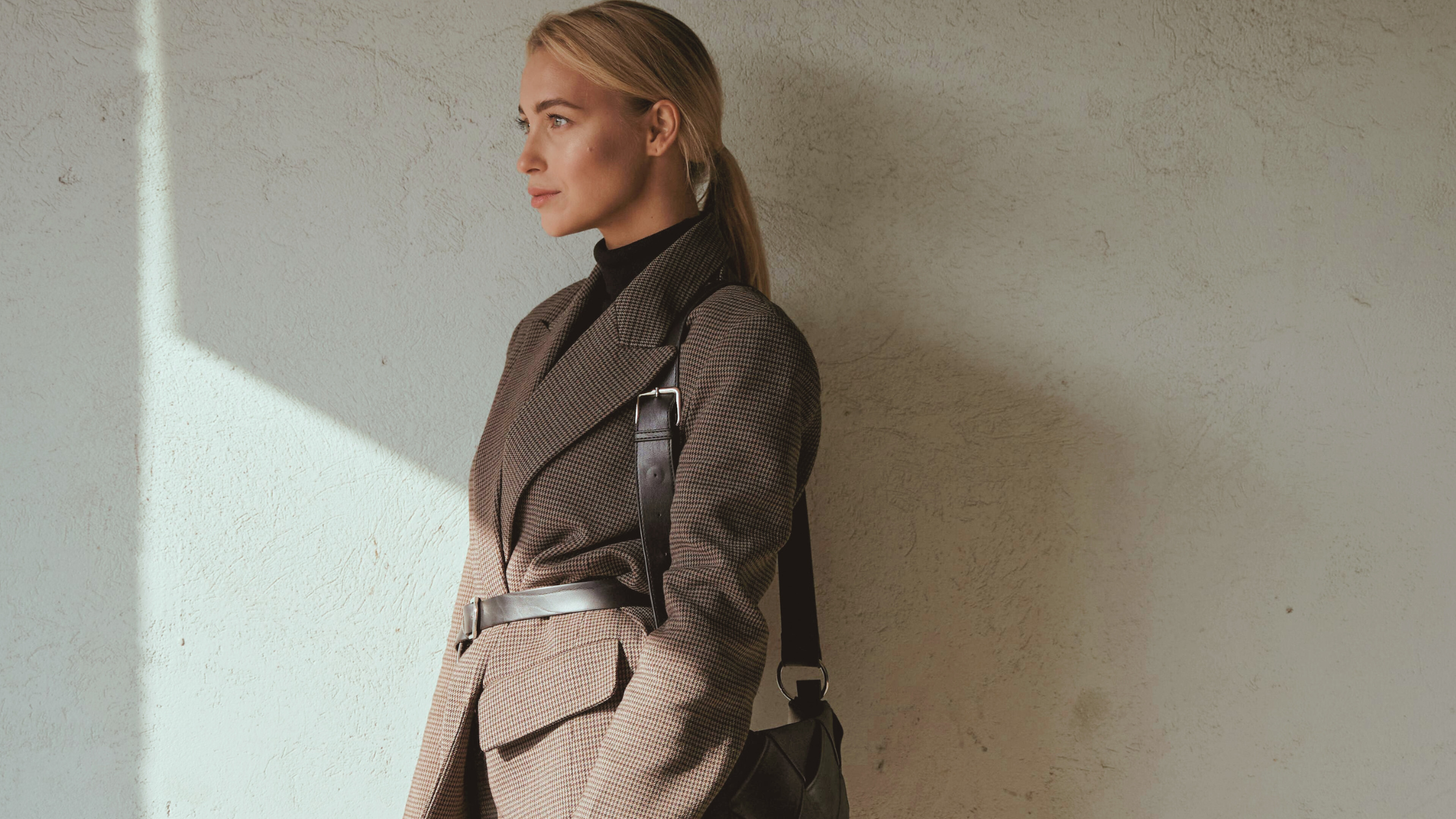 Styled After professional, accomplished woman styled by personal stylist in a blazer, turtleneck, and belt.