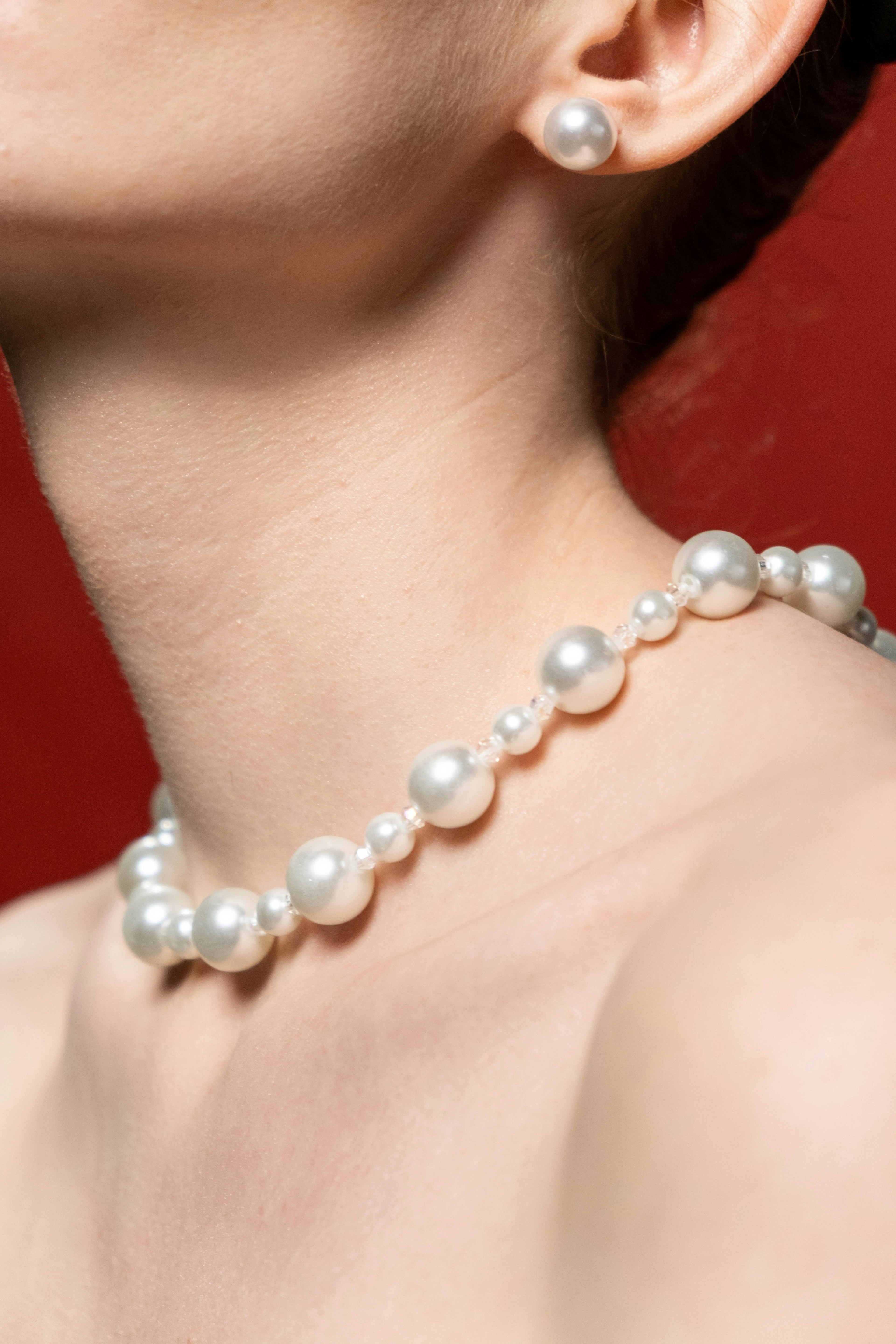Pearl necklace and earrings inspired by Charlotte York in And Just Like That, curated by Styled After.