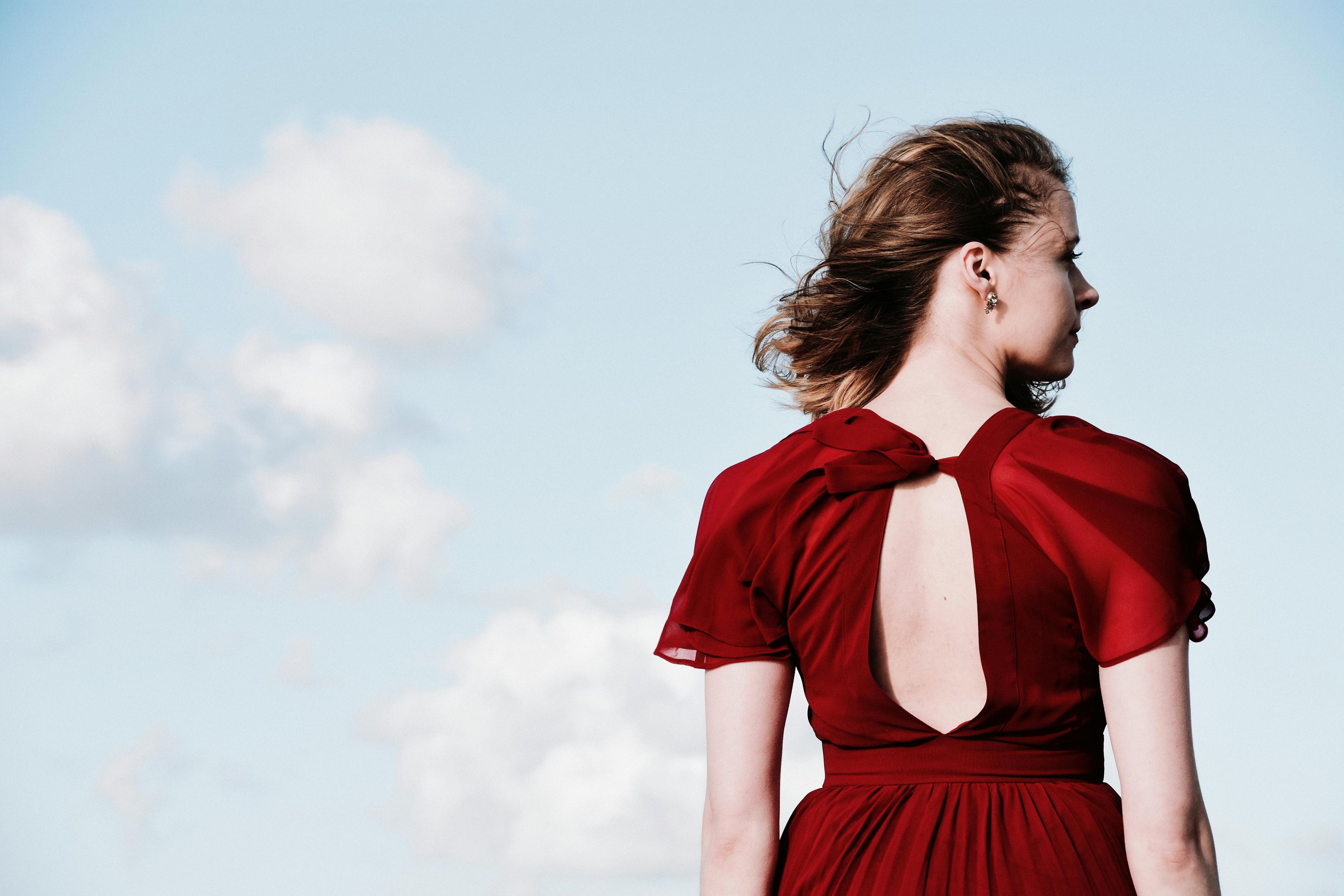 Crimson red silk dress, an elevated outfit inspired by And Just Like that, curated by Styled After.